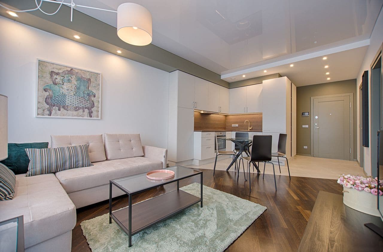 family living room and kitchen with refrigerator and shared seating