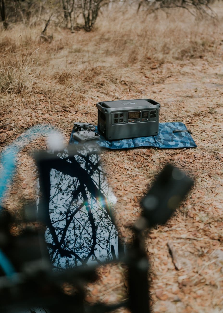 portable power station with a solar panel in an outdoor camping setting