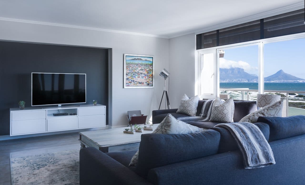 solo apartment living room with electric fan air purifier and compact essentials