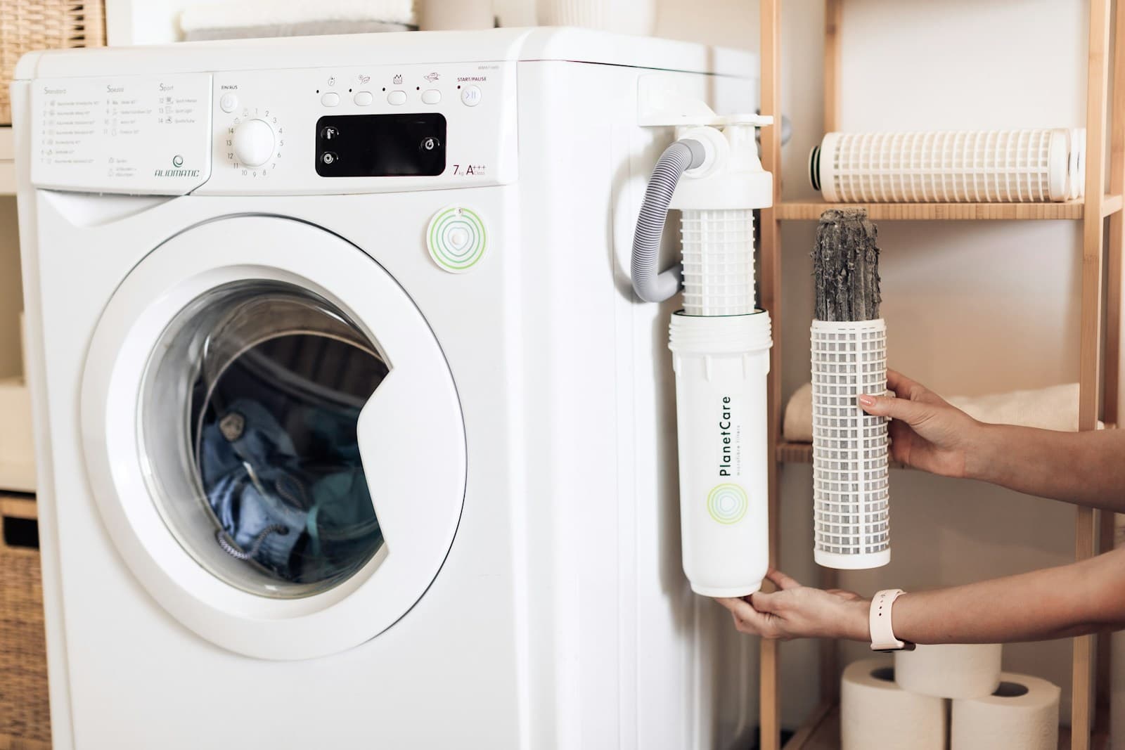 white front load washing machine in a laundry room
