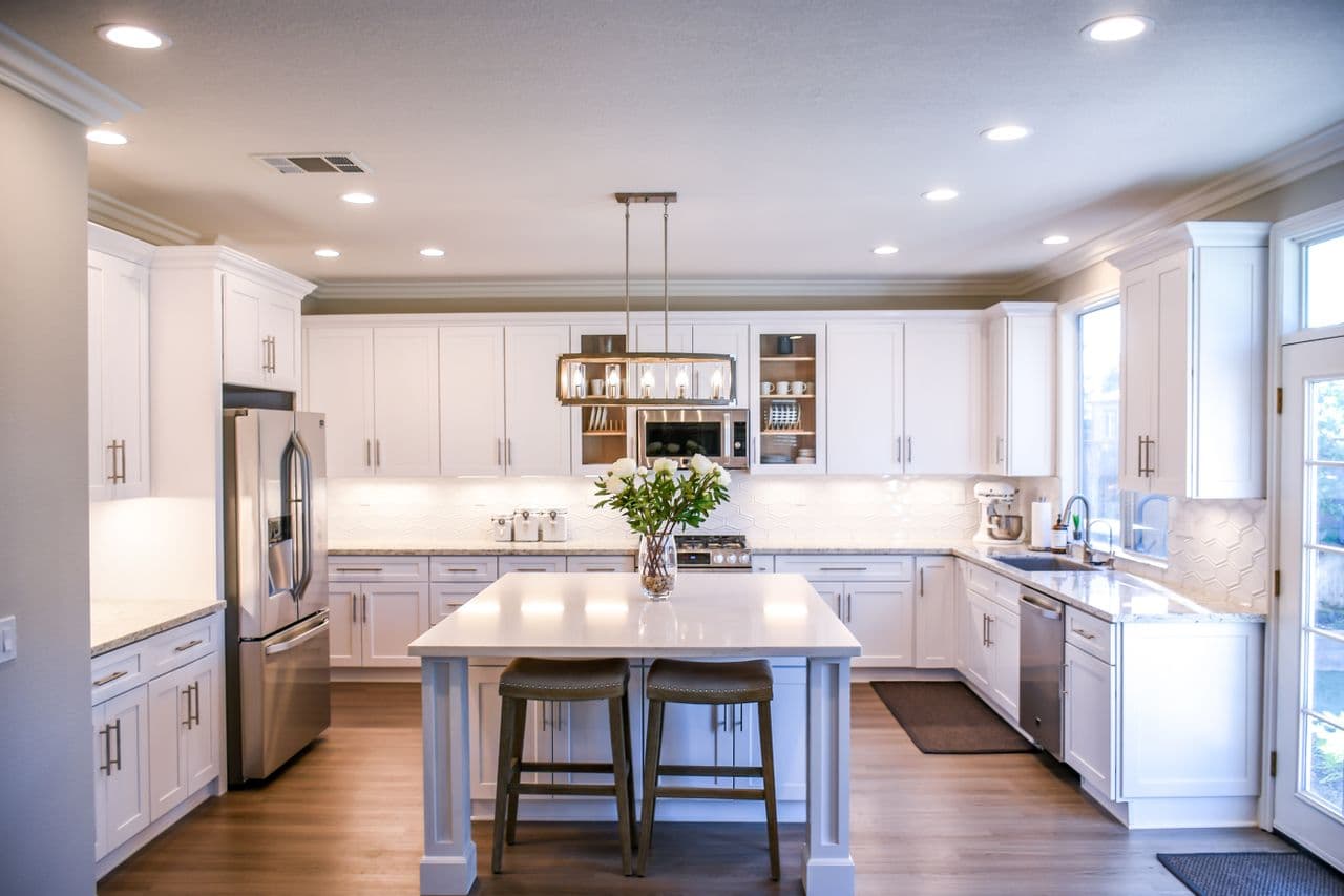 compact apartment kitchen with portable ac and small counter appliances