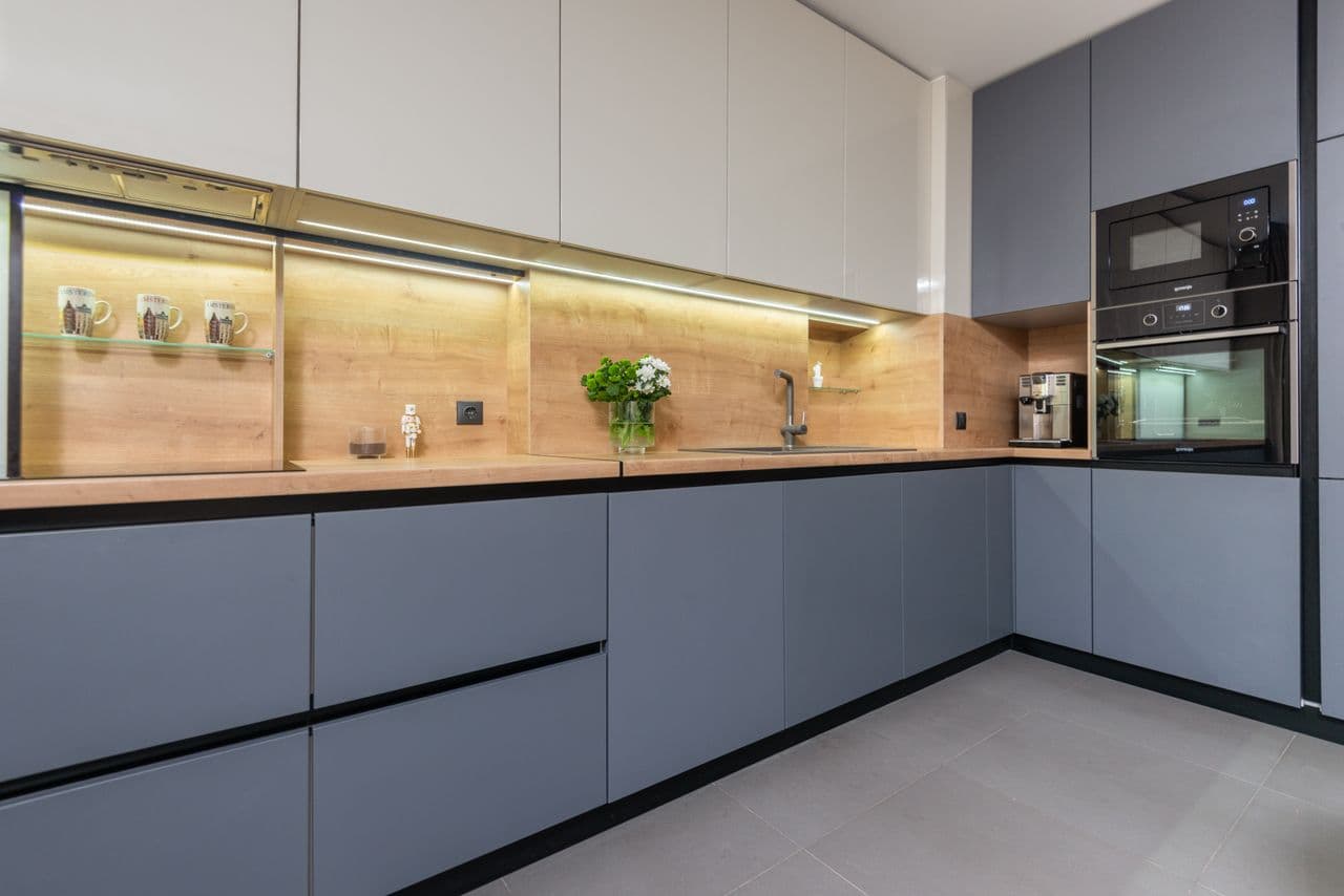 compact kitchen appliances and portable AC in a space-saving apartment layout